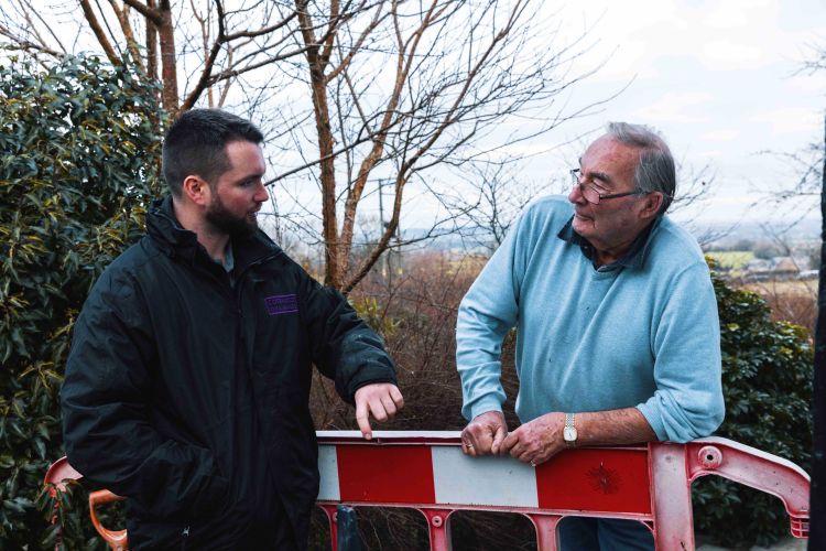 A Cotswold Drainage engineer speaking to a client